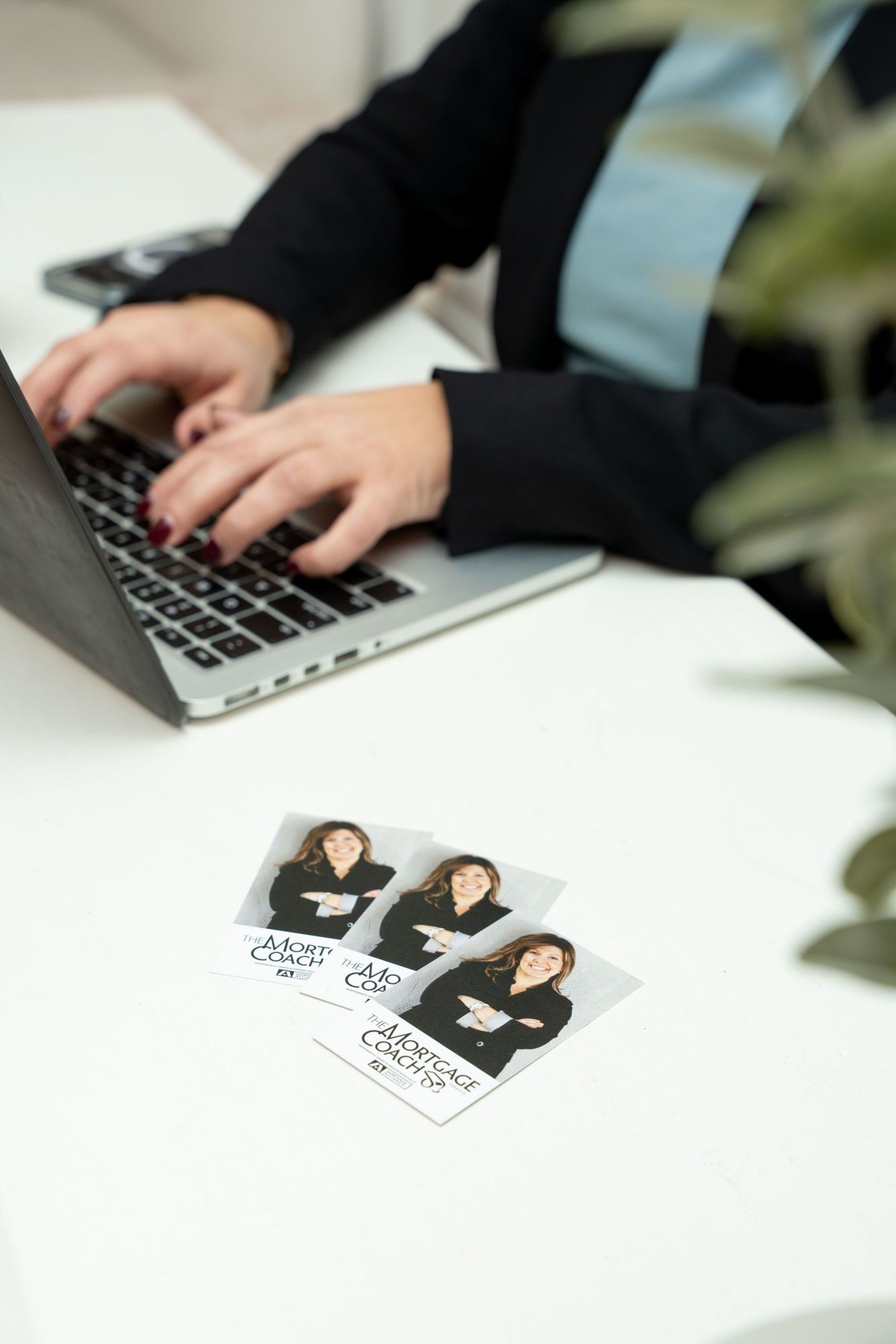 Stephanie is ready to help, standing, and giving her business card and contact info