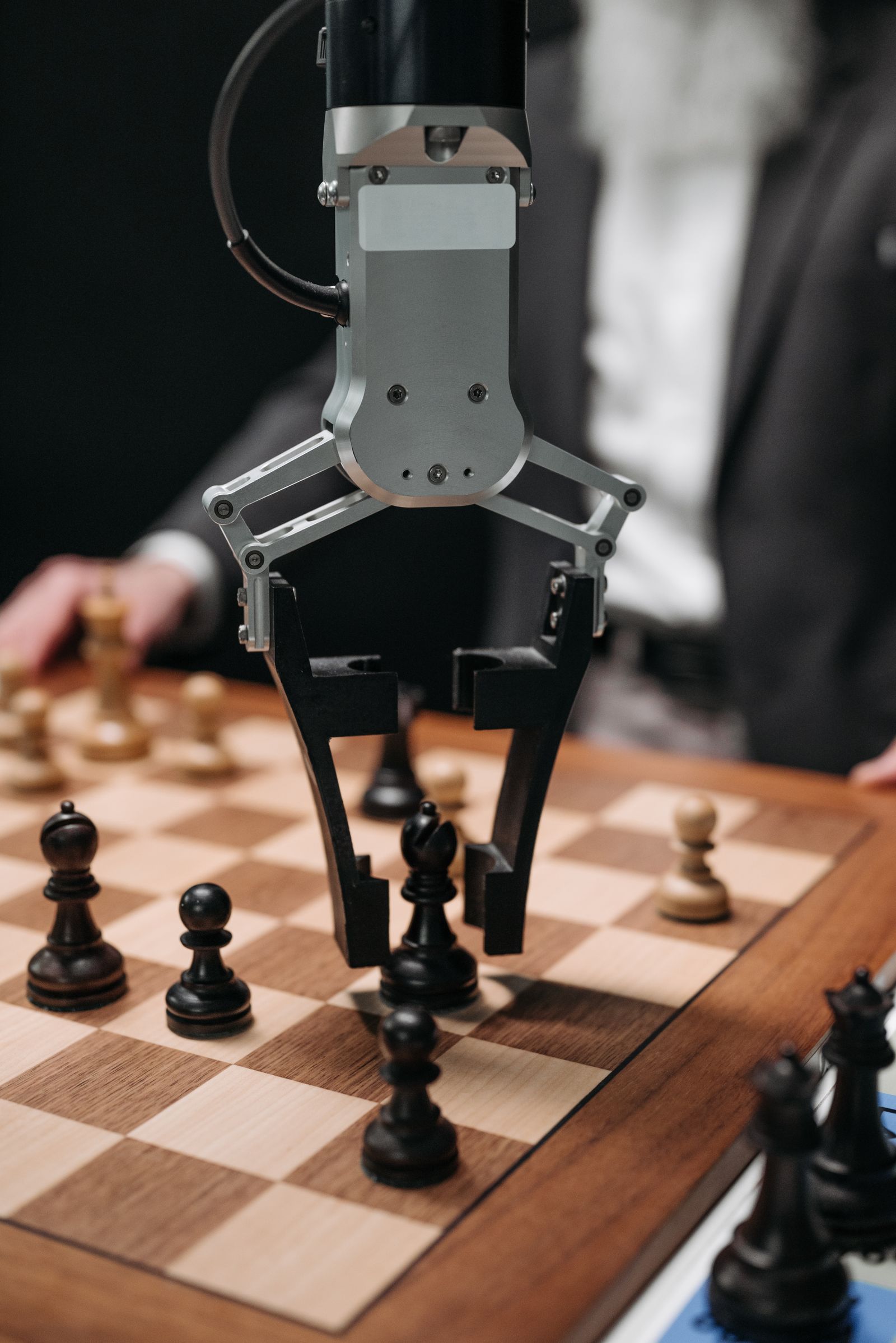 A robot and a human interacting, representing reinforcement learning from human feedback.