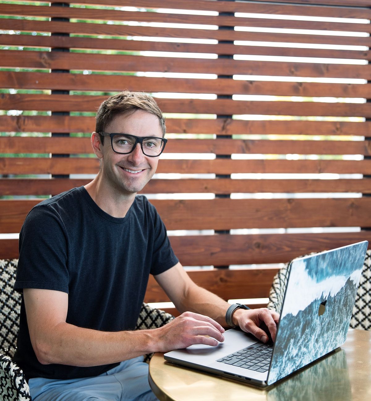Connor Walberg working on a website at a coworkign space using a macbook pro
