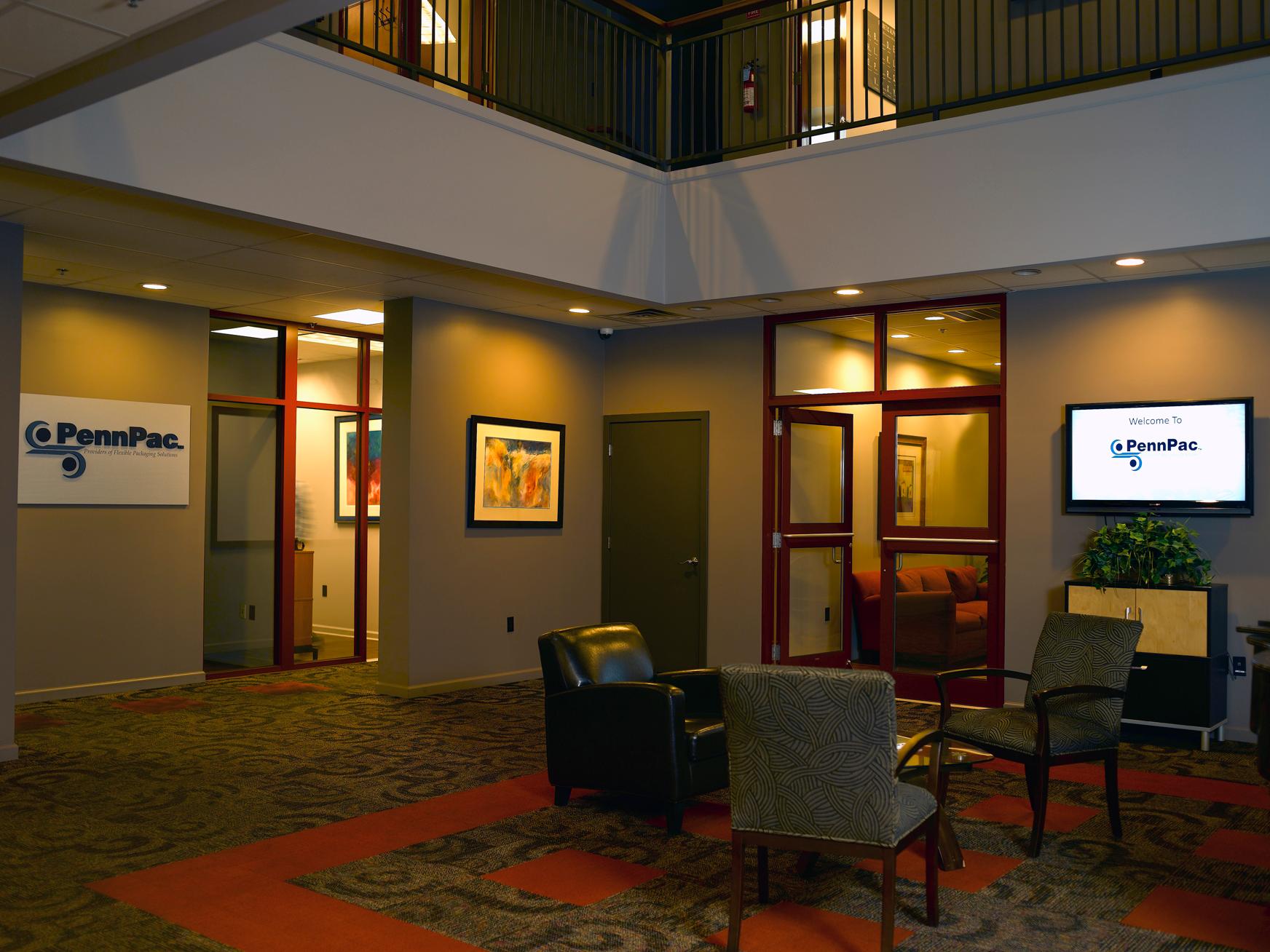 PennPac headquarters lobby, Manheim, PA Reception lobby at PennPac's Manheim, PA headquarters with a PennPac wall sign, a welcome screen, and guest seating.