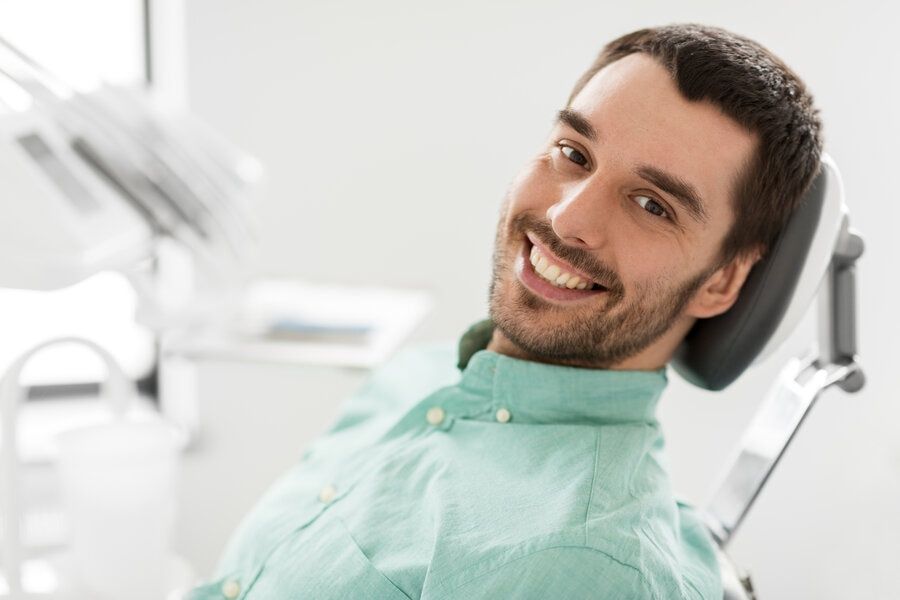 Patient in dental chair is happy with no drilling dentistry