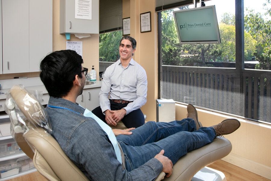 Dentist Dr Pries Talks to Patient About Benefits of Laser Dentistry in San Jose