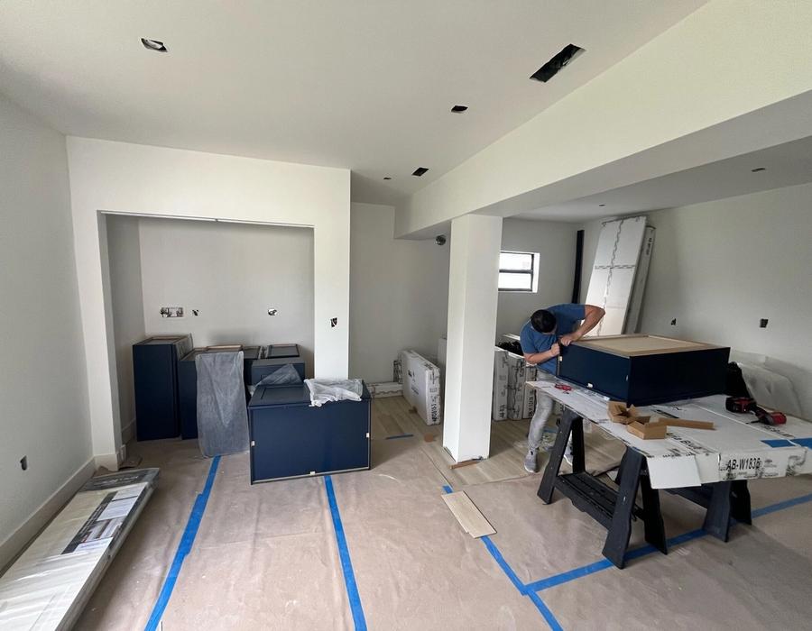 Fire restoration project in Miramar, FL with new cabinets, structural repairs, and ongoing interior reconstruction.