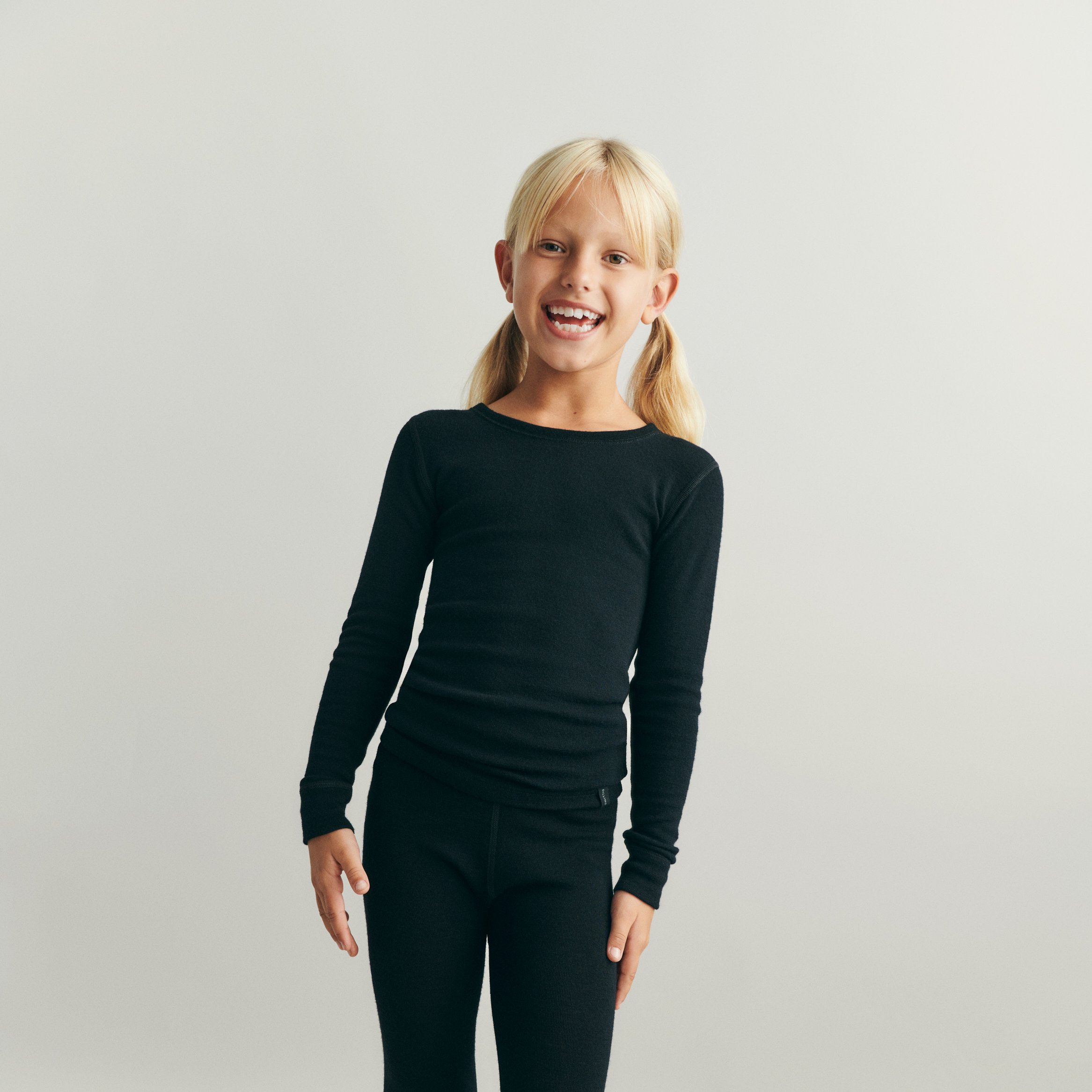 Child standing in DILLING clothes