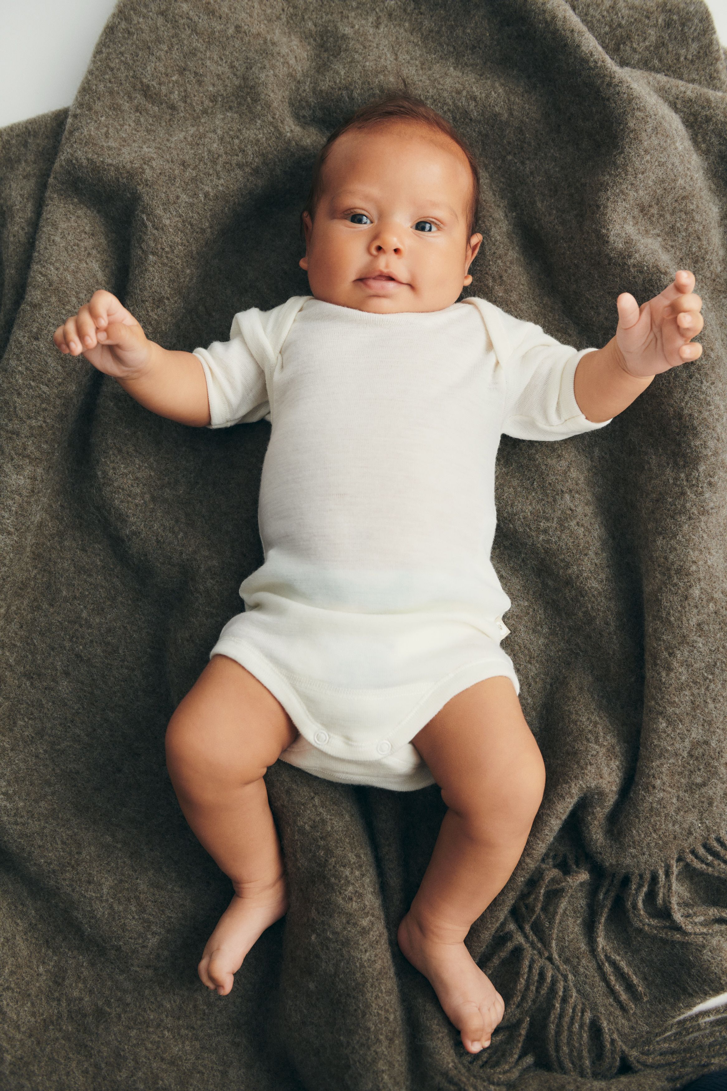 Baby lying on a carpet
