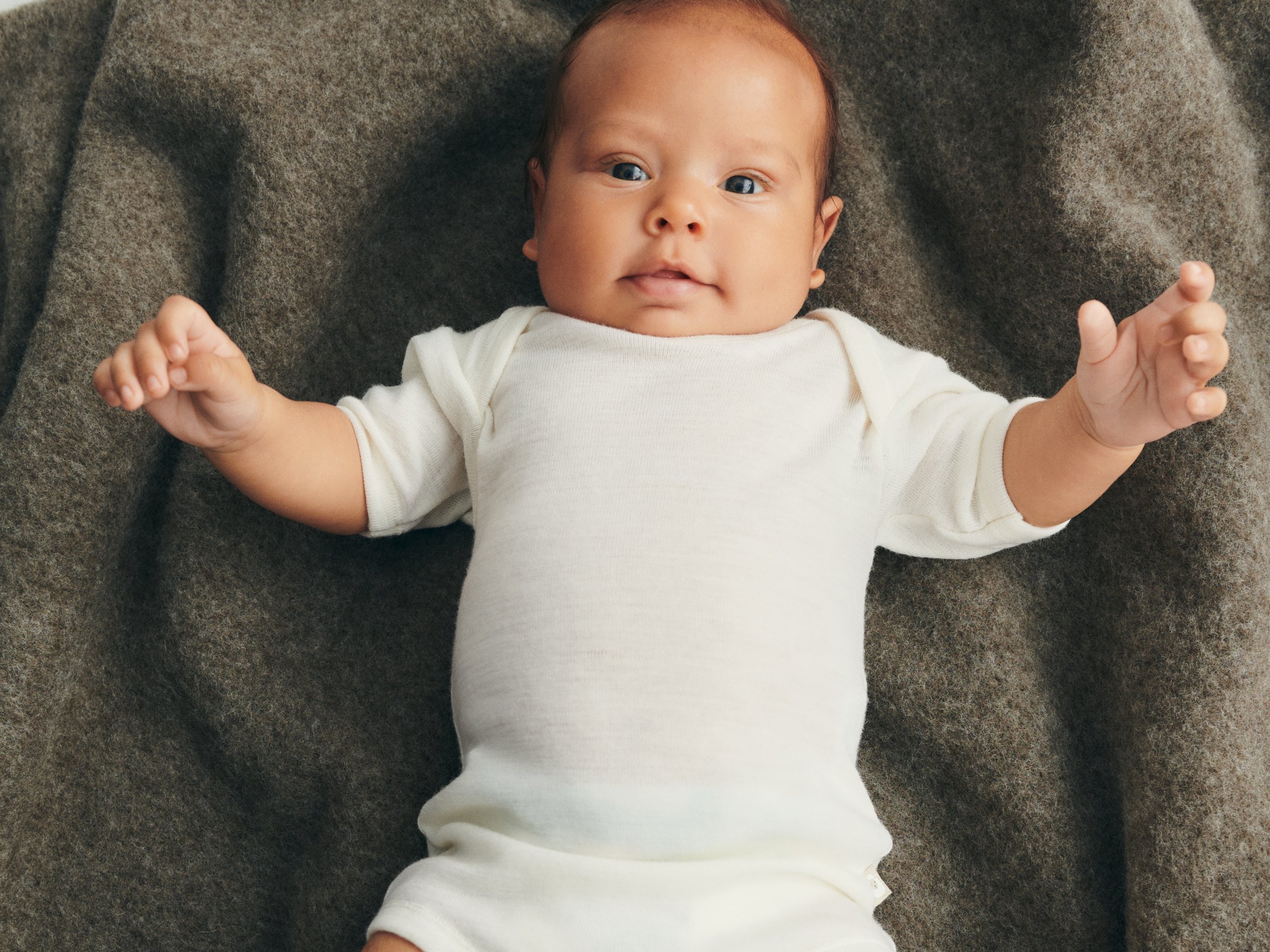 Baby lying on a carpet