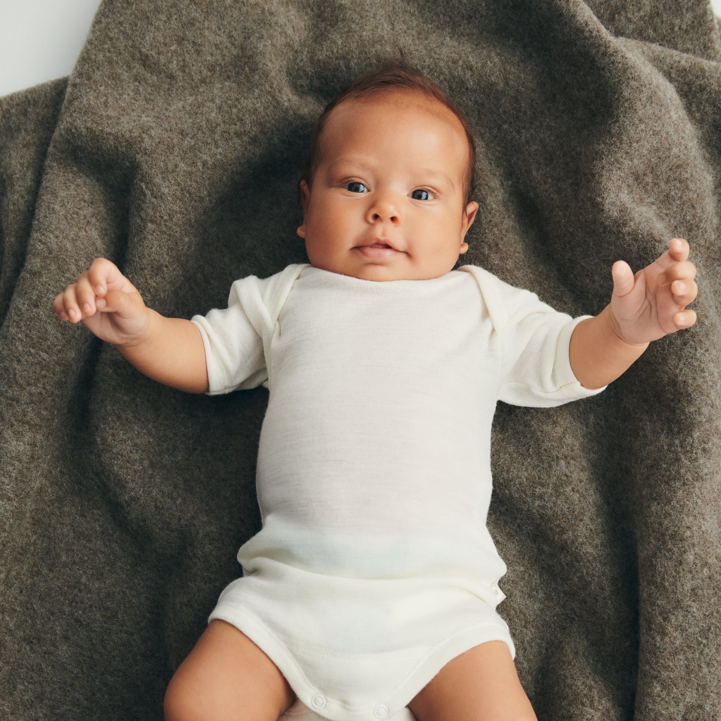 Baby lying on a carpet