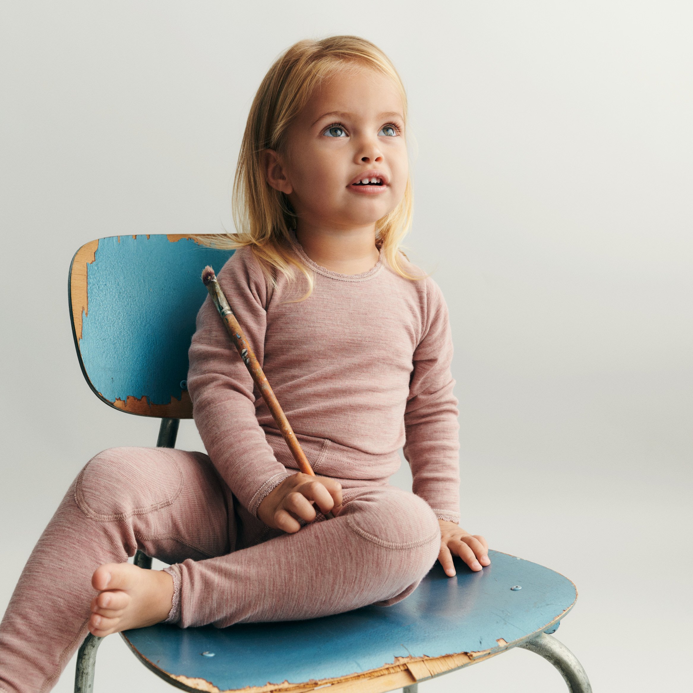 Toddler sitting on a chair