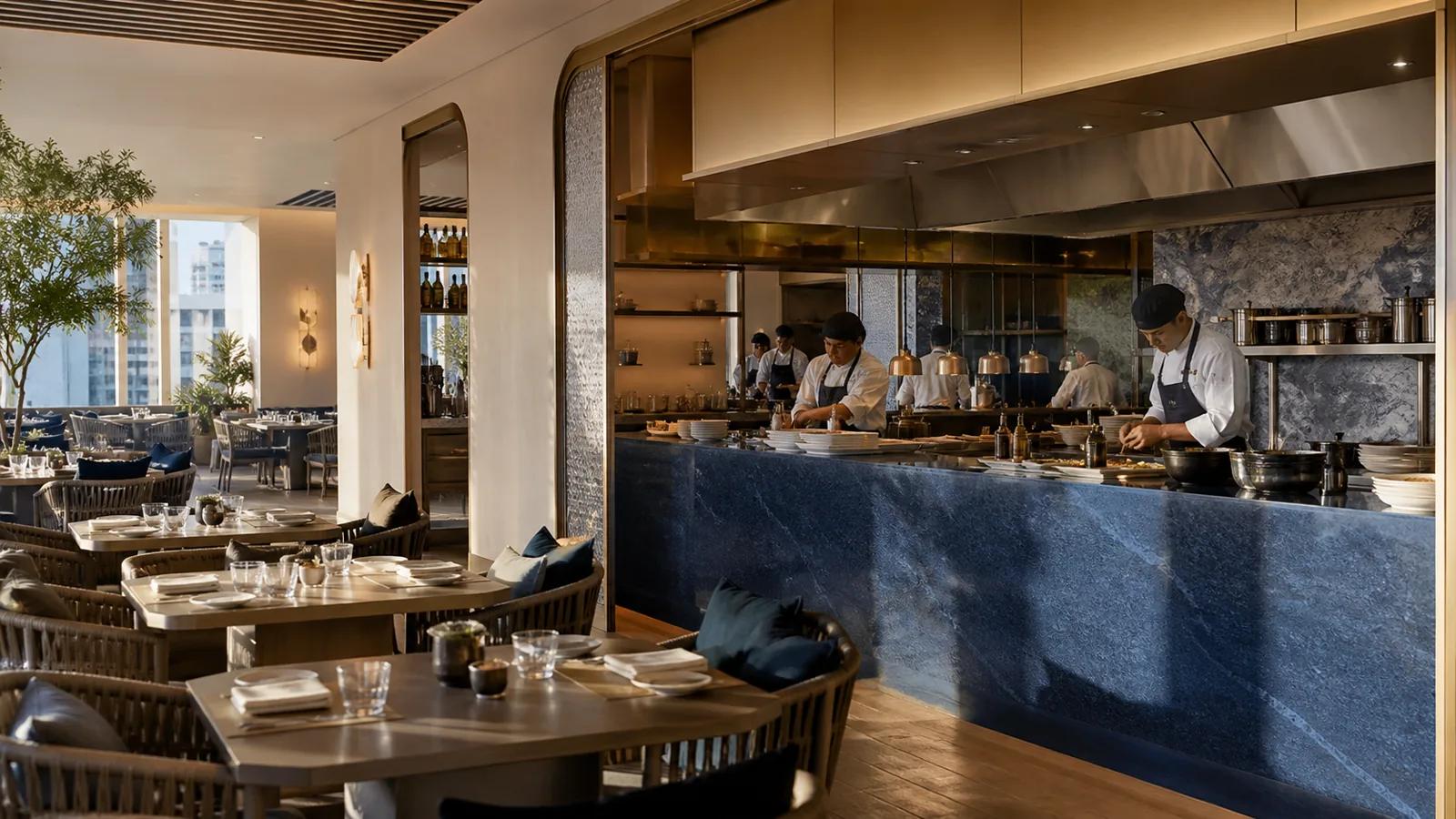 Restaurant à Dubaï avec salle élégante et cuisine professionnelle ouverte