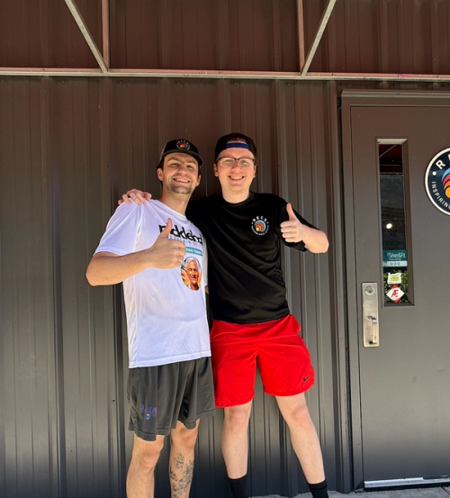 Evan & Pike standing outside of RECS together
