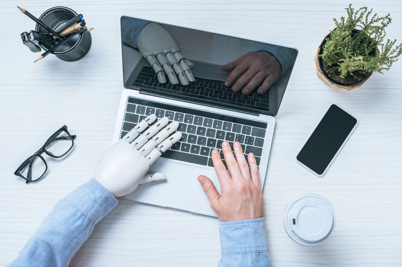 ai is just a toll - image shows ai on one hand and human on the other