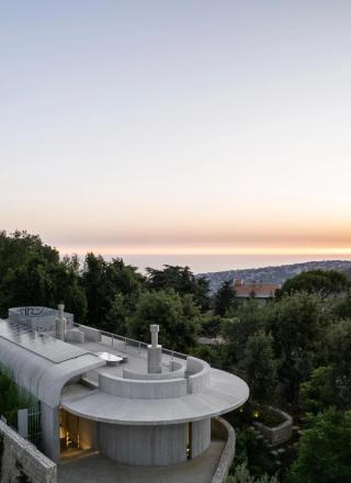 View of Capsule Rretreat house on hilltop overlooking the sea