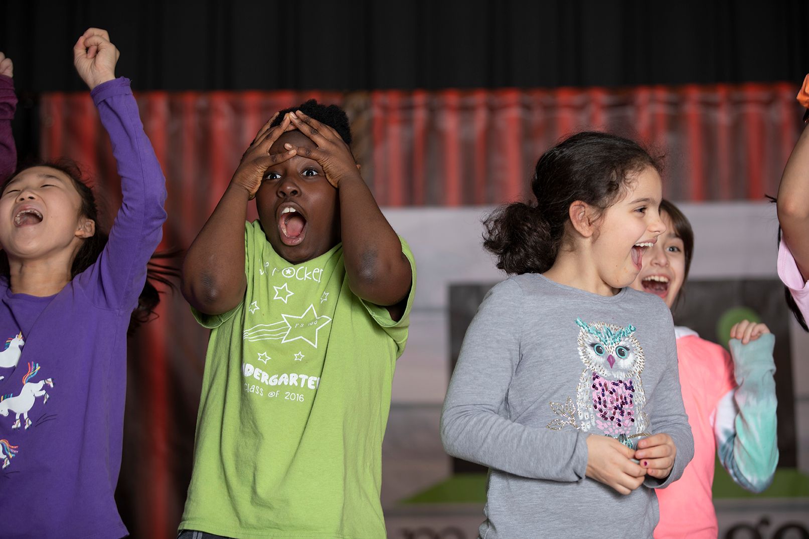 excited kids on stage