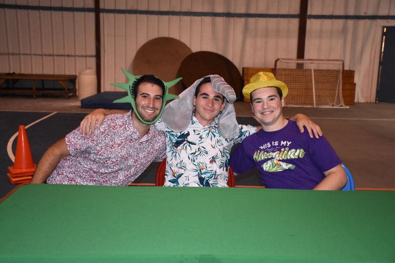 three young men in funny costumes