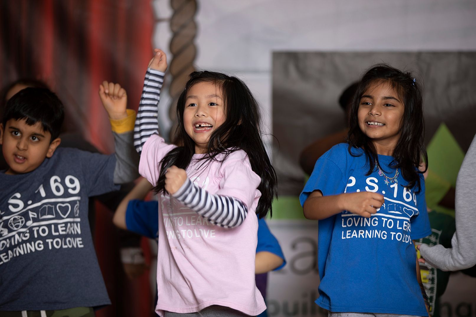 group of children on stage dancing