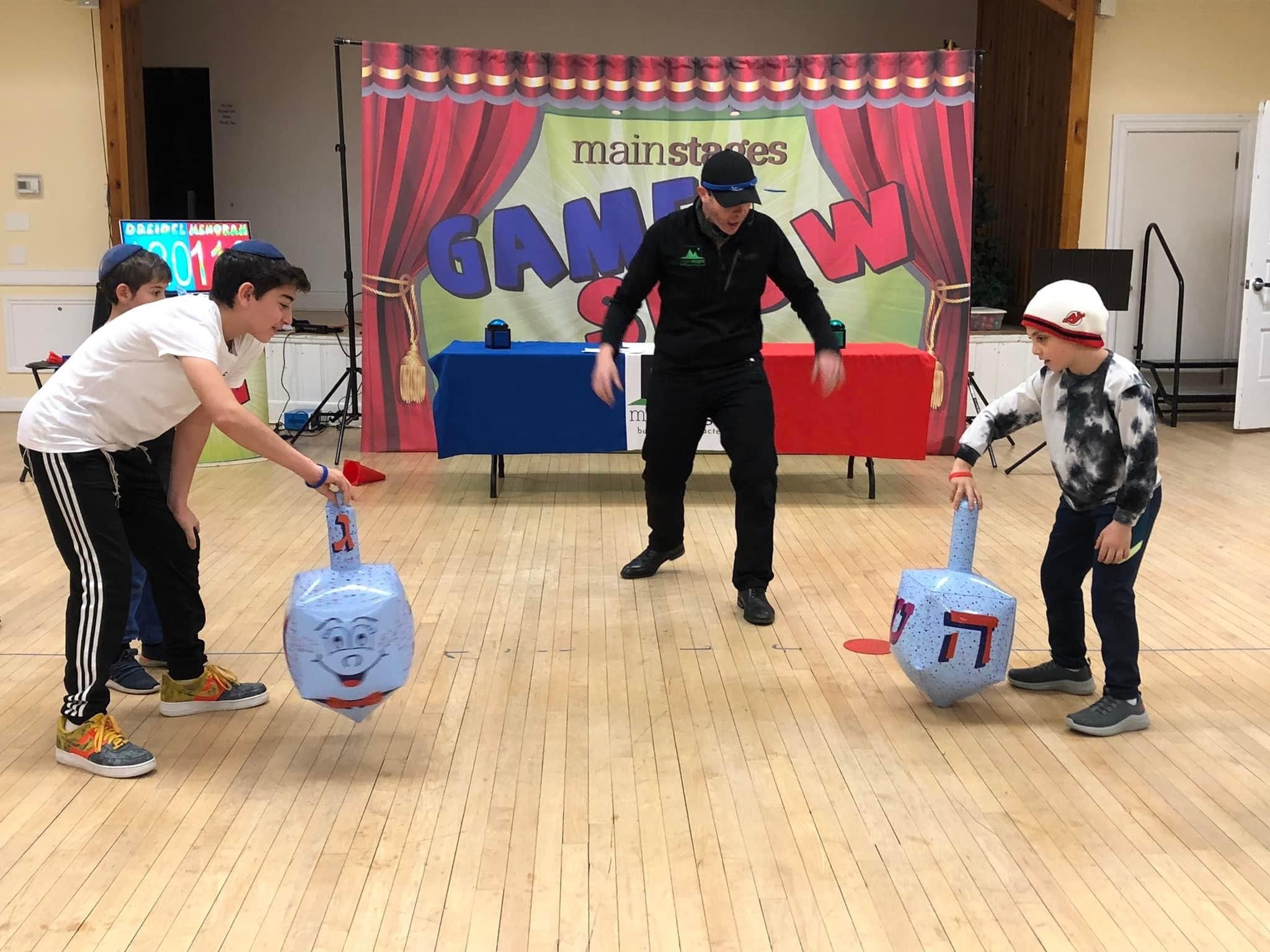 Kids standing behind buzzers