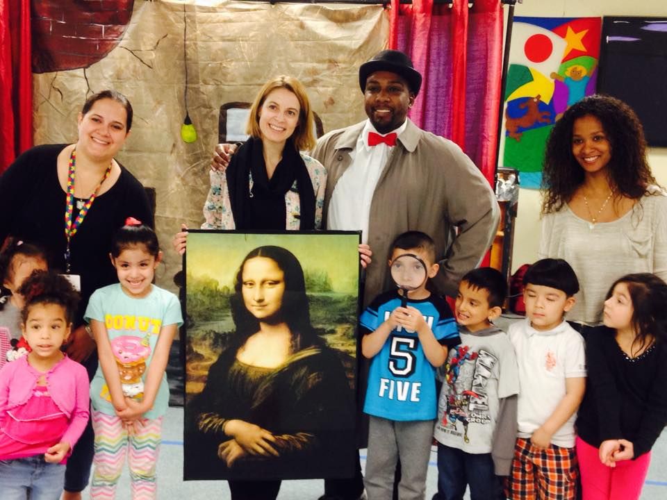 Detective poses with child after show