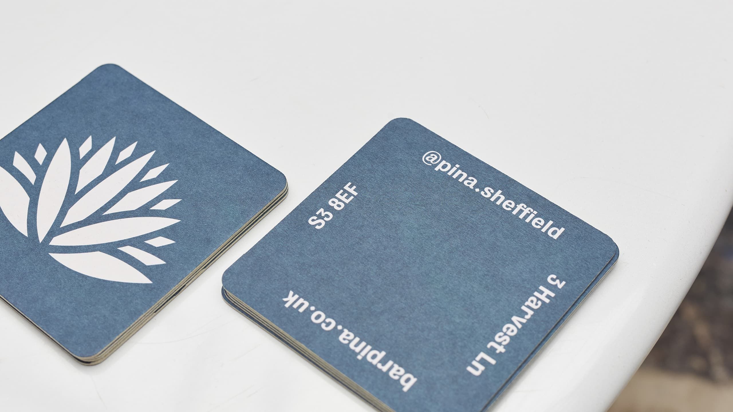 Double-sided, piña branded beer mats.