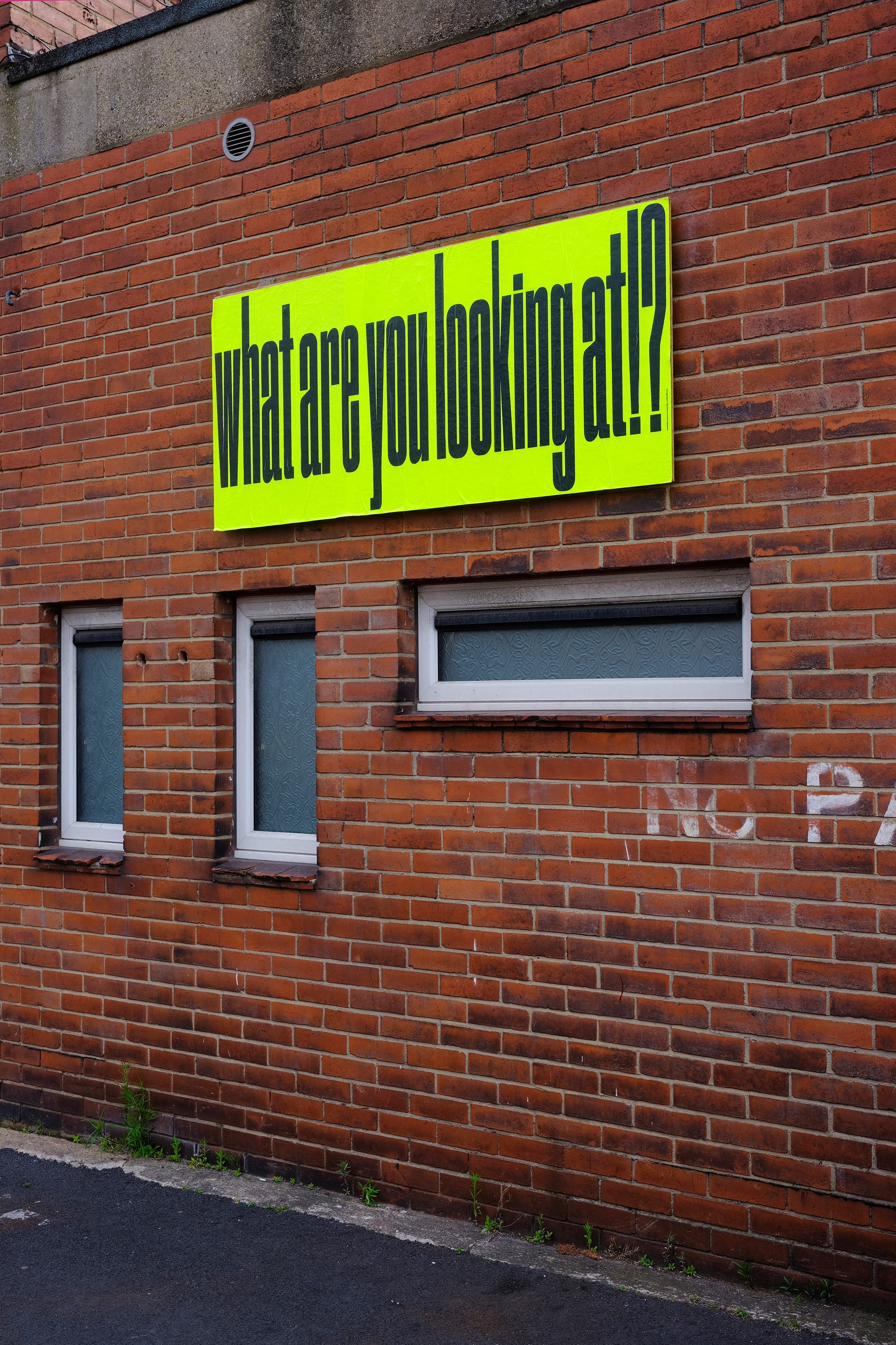 NoPARKING poster submission shown on the façade of Sheaf Street, Leeds.