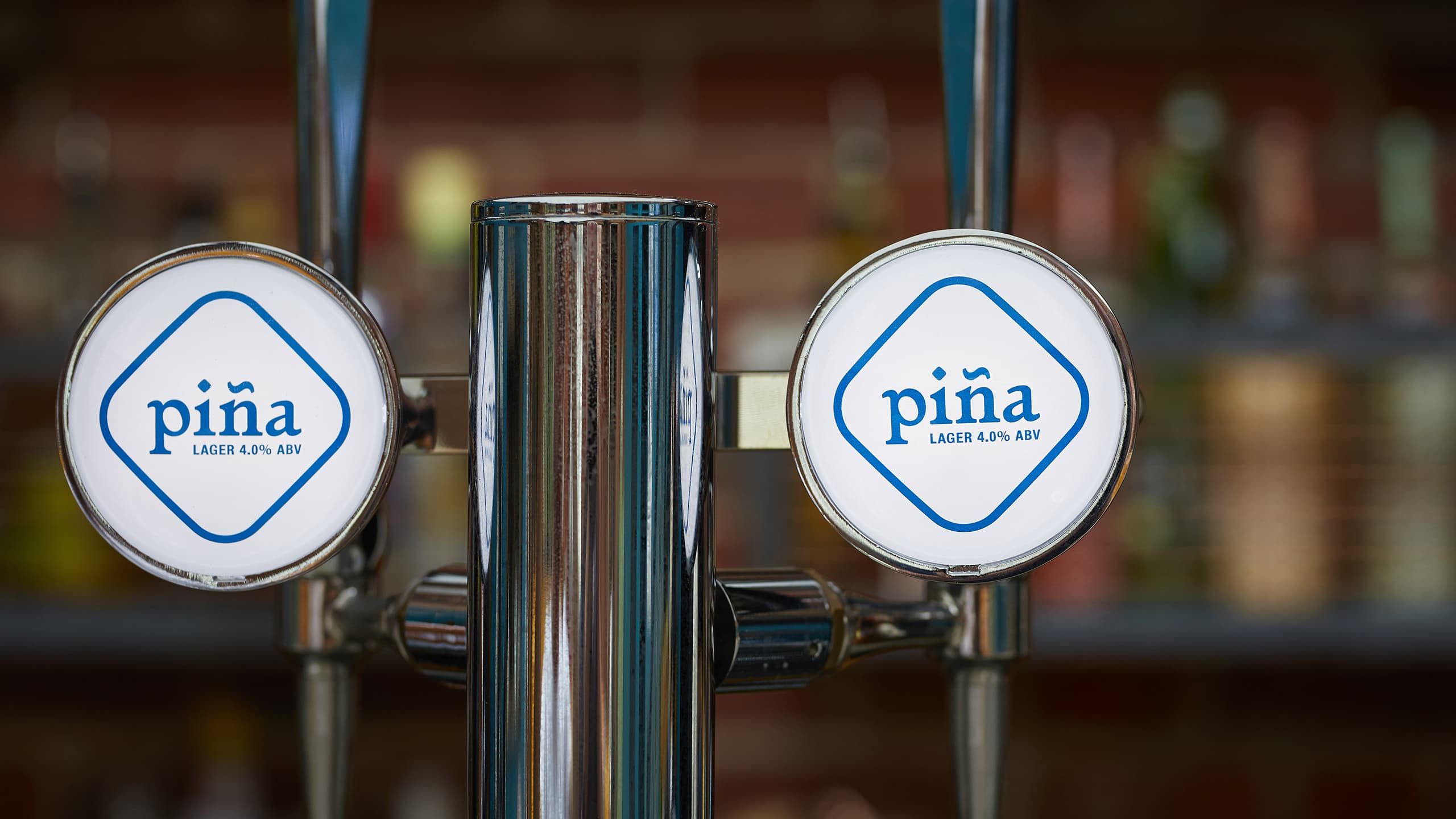 The branded beer taps at piña, Sheffield.