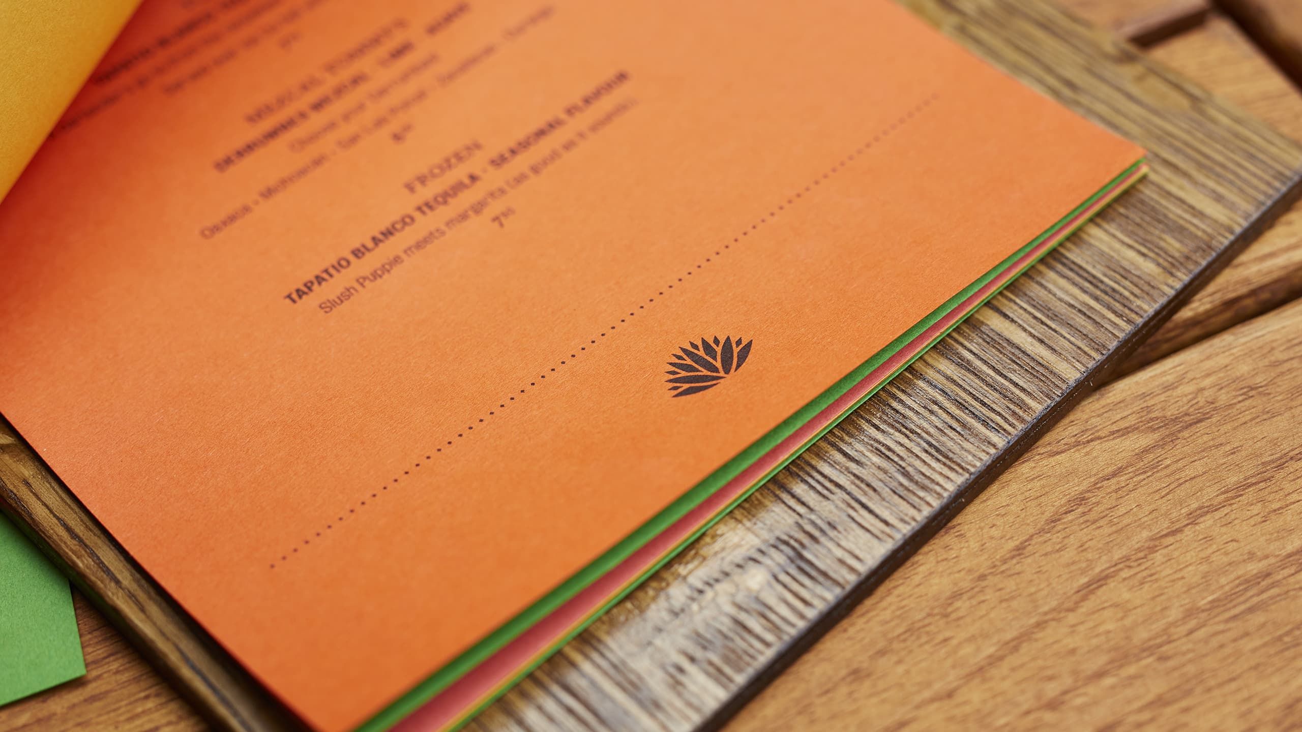 piña's agave logo shown at the bottom of one of the drinks menu's pages.