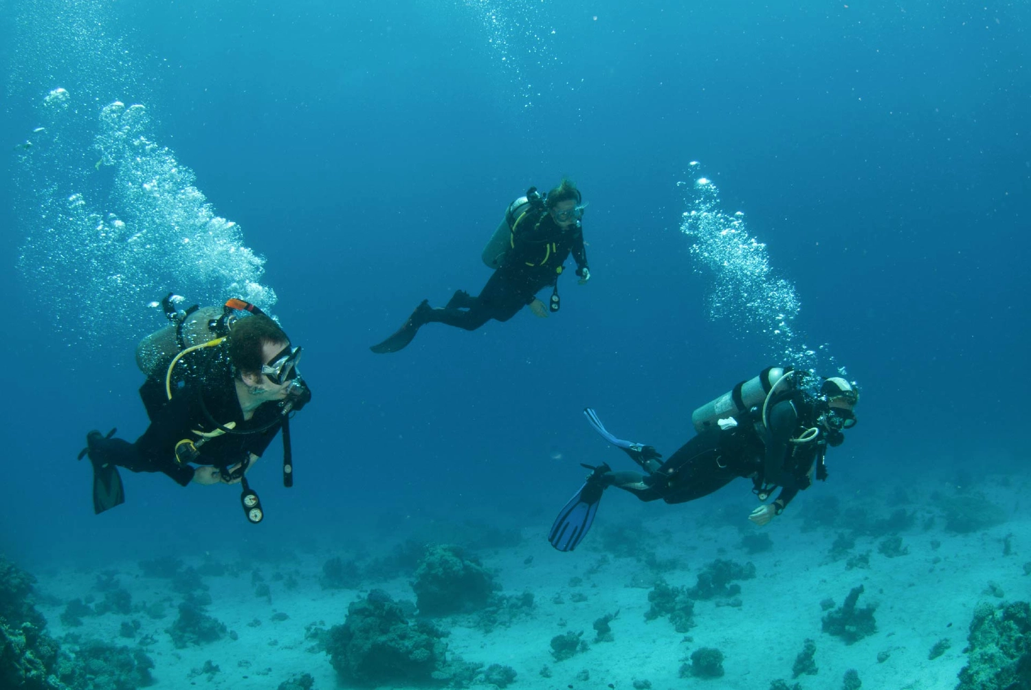 Friends scuba diving in Greece