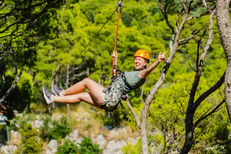 Woman ziplining