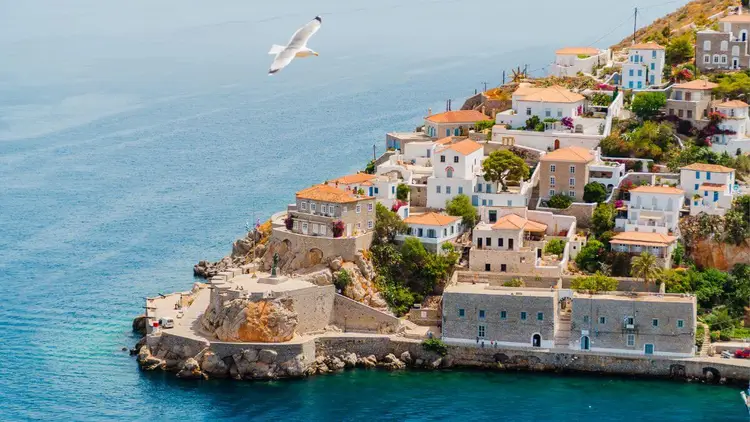 Hydra town on Hydra island in the Saronic Gulf of Greece, a must visit island near Athens famous for its beauty and white-stacked villas similar to Santorini.