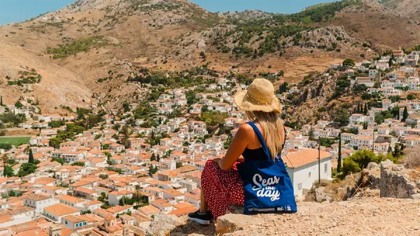 Woman looking at the view over Hydra town