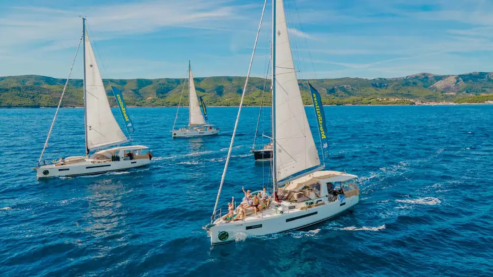 Economy yachts sailing in a flotilla