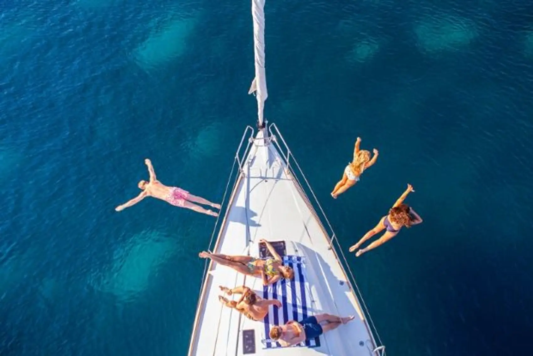 MedSailors guests jumping off of a yacht while island hopping in Croatia.