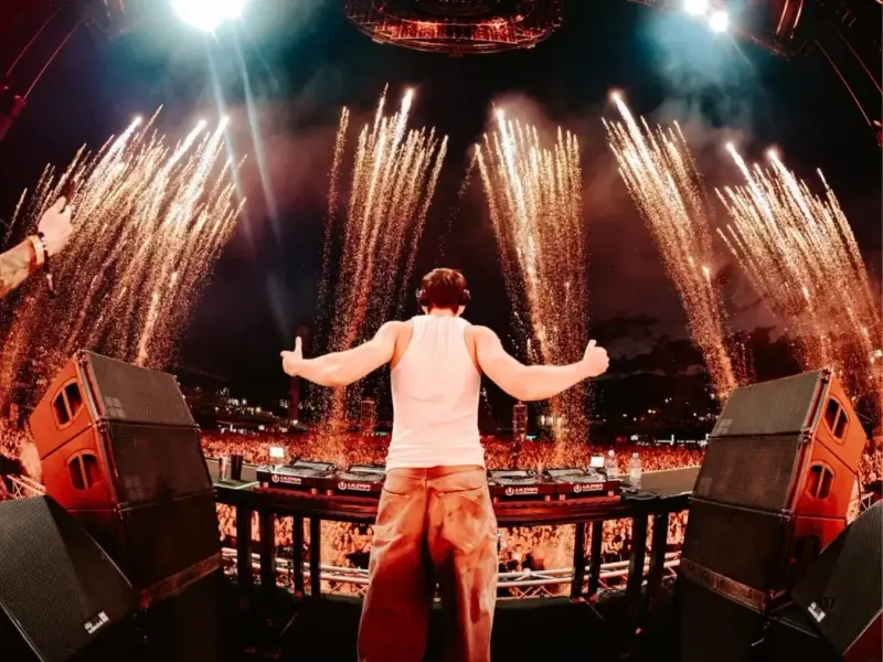 DJ performing on stage at ULTRA Europe in Split, Croatia, with fireworks exploding above the crowd during a huge late-night festival set. A strong image for content about ULTRA Europe 2026, the festival line-up, main stage atmosphere, tickets, and planning a Croatia summer music trip.
