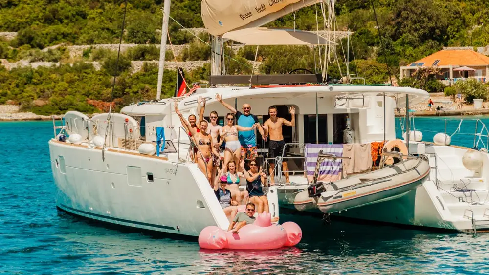 Group of people on the back of a catamaran