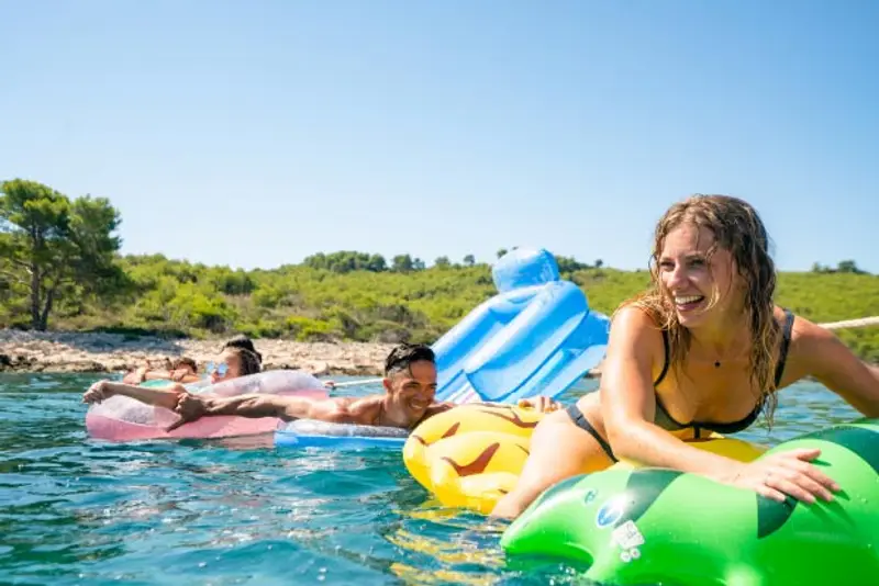 Image of people in the water on inflatables