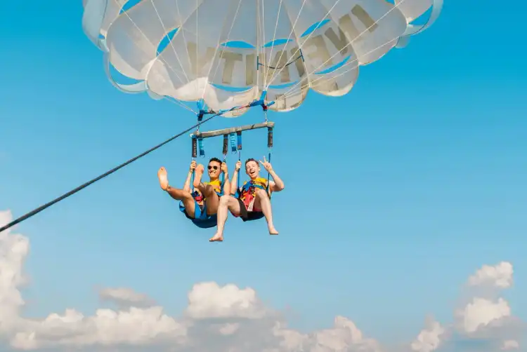 Two friends parasailing in Croatia