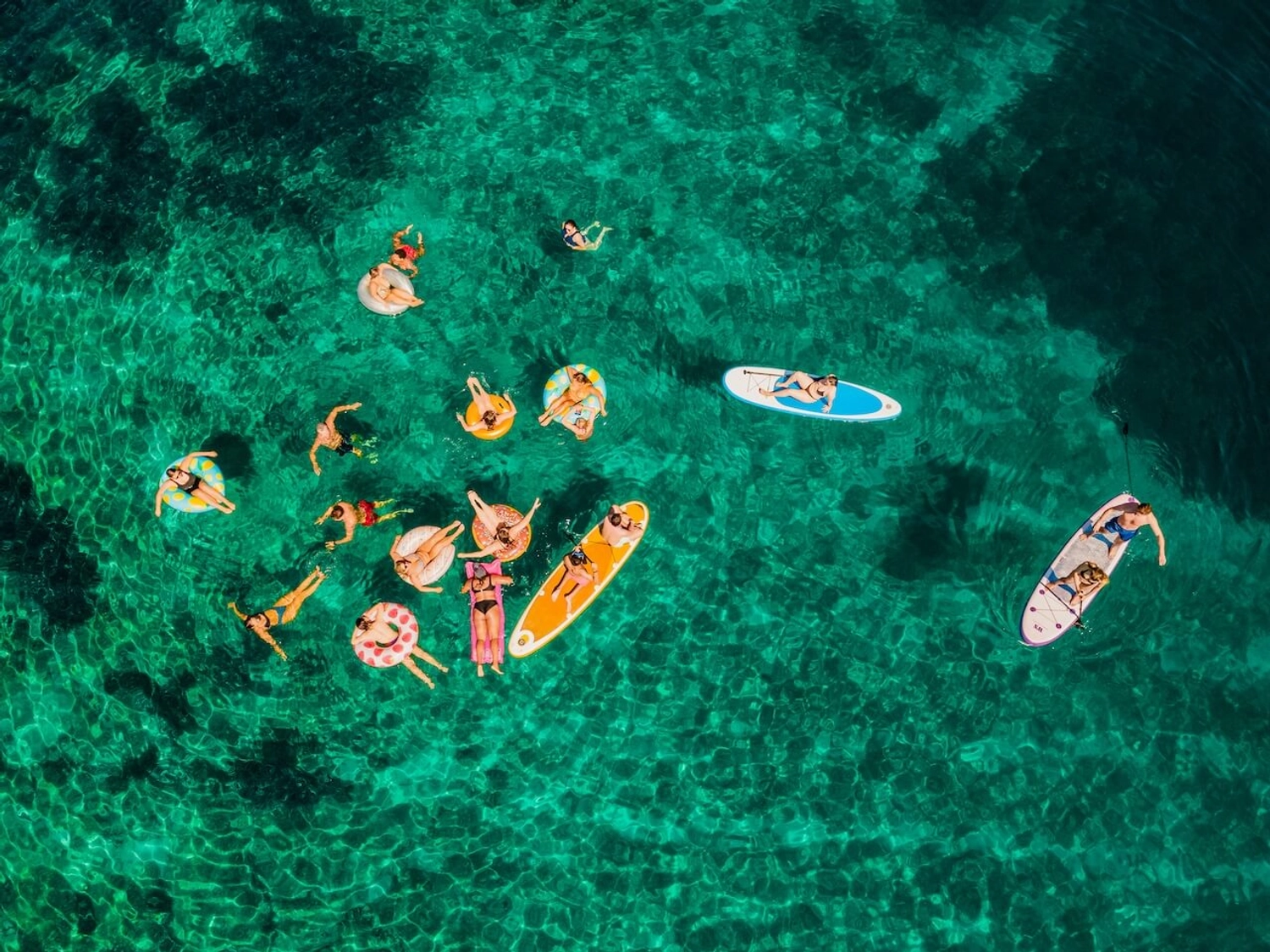 Guests on floaties on a sail week in Croatia with MedSailors for adventure travellers in their 20s and 30s.