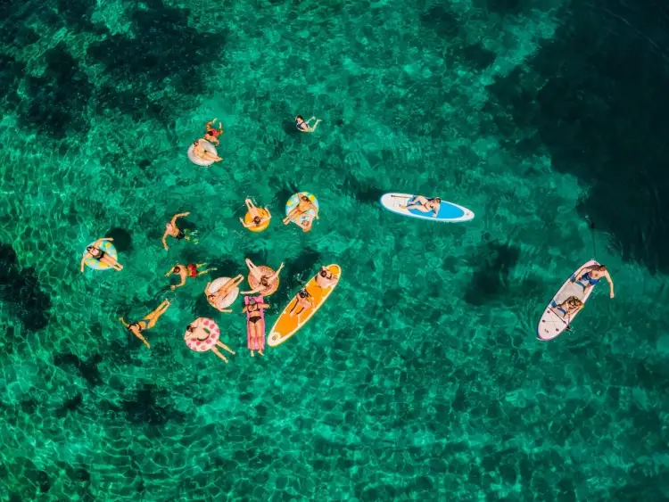 Guests on floaties on a sail week in Croatia with MedSailors for adventure travellers in their 20s and 30s.