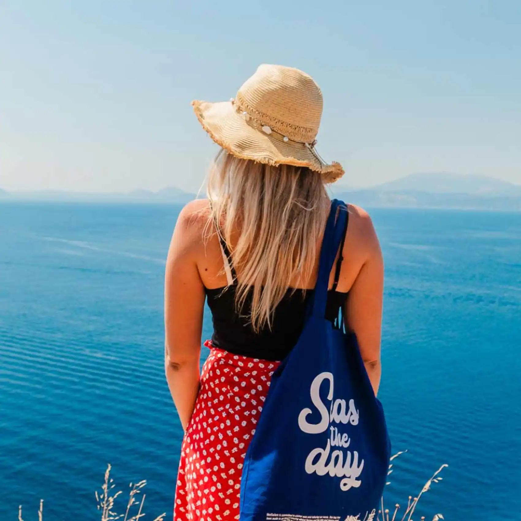 Woman looking at view over Hydra in Greece