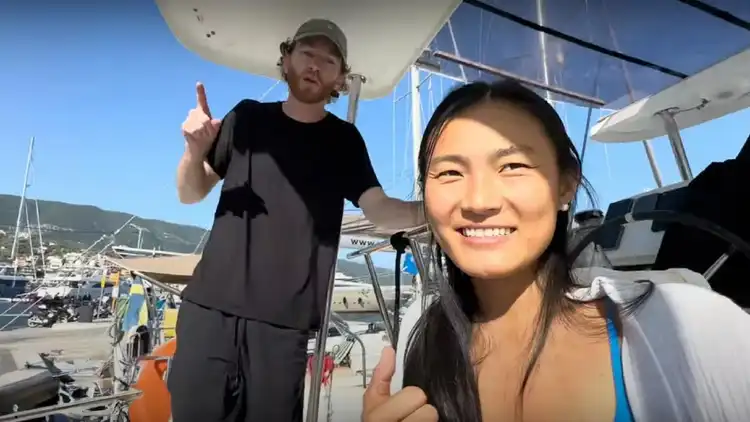 Claire & Peter giving a tour of the MedSailors catamaran