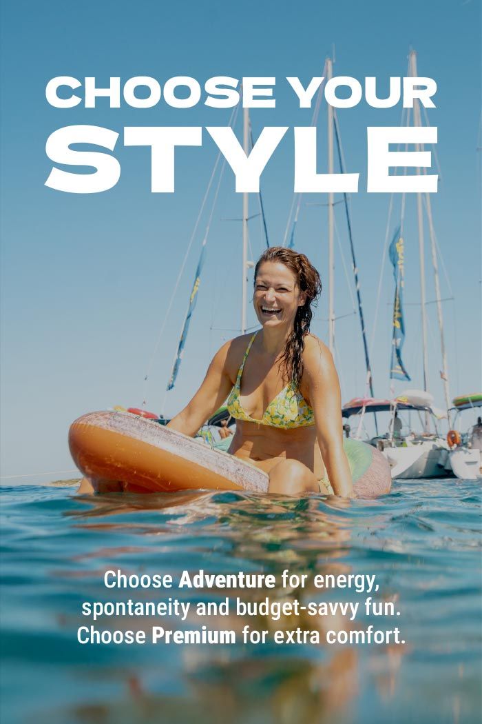 Woman on a floatie in front of some yachts