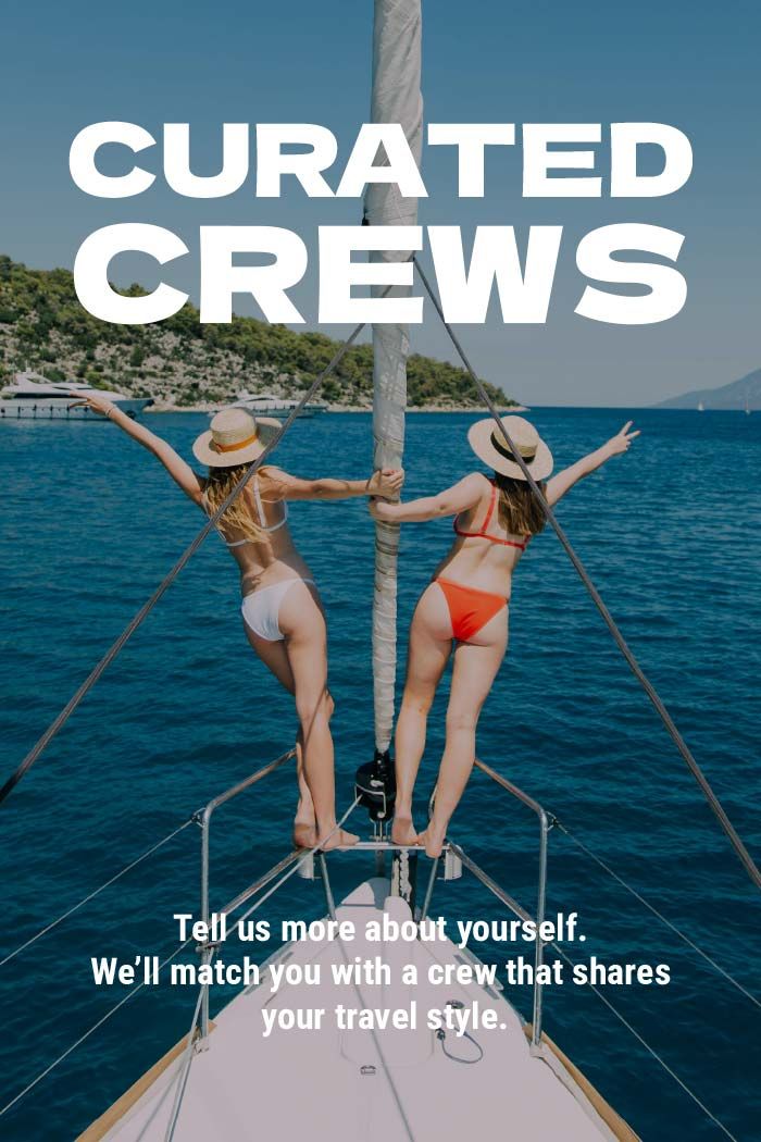 Two women on the bow of a yacht