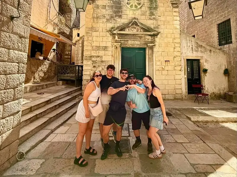 Group of MedSailors travellers exploring a historic Croatian old town together during an 18–35 Croatia island-hopping sailing trip.