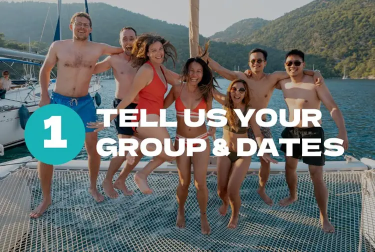 Group of people jumping on the bow of a yacht