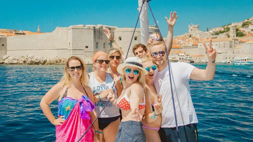 MedSailors guests pose for a photo in front of Dubrovnik Old Town