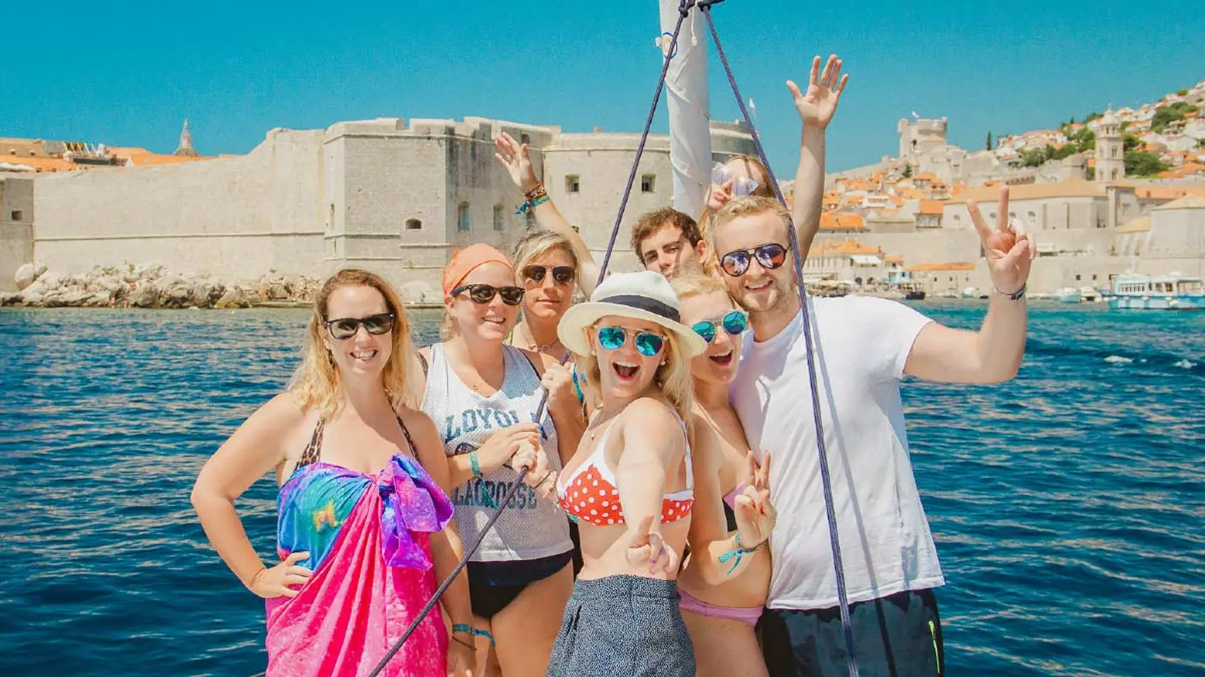 MedSailors guests pose for a photo in front of Dubrovnik Old Town