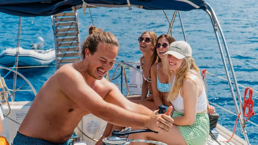 Man learning to sail on a MedSailors yacht