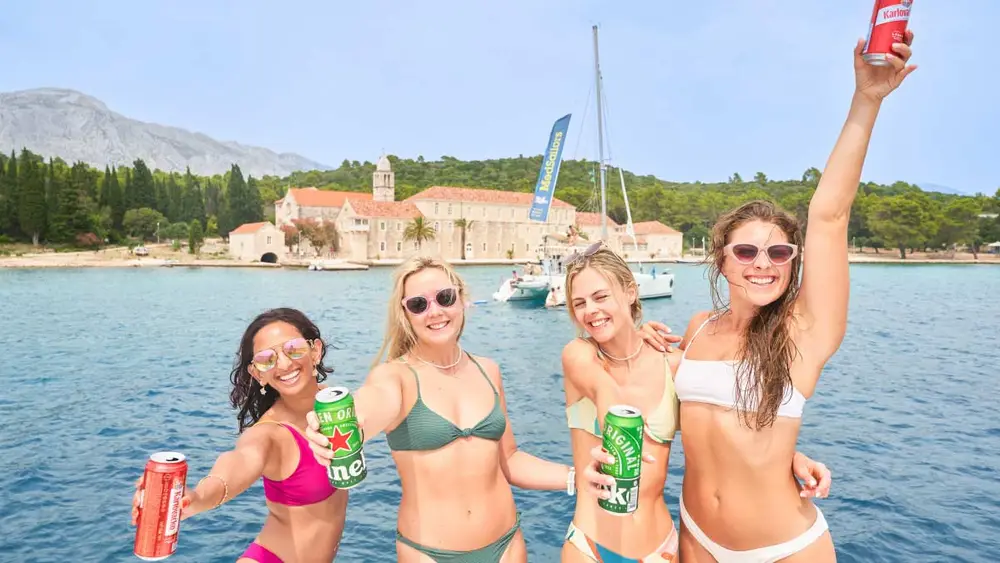 Group of women on a yacht some beers