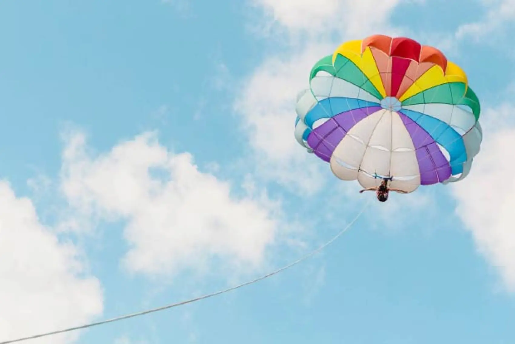 Photo of a female parasailing in Poros Greece.