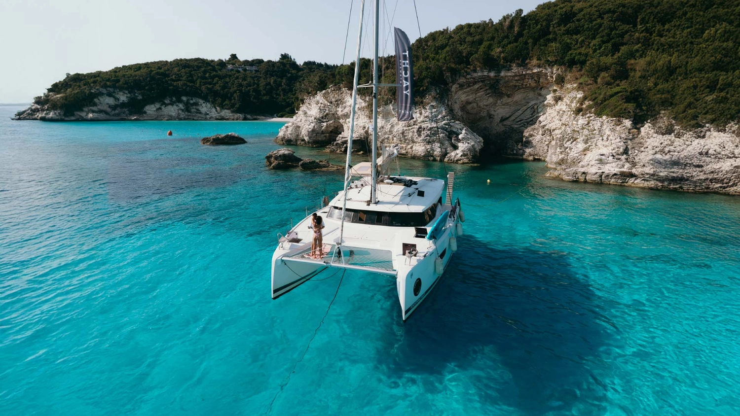 Luxury catamaran anchored in a beautiful bay