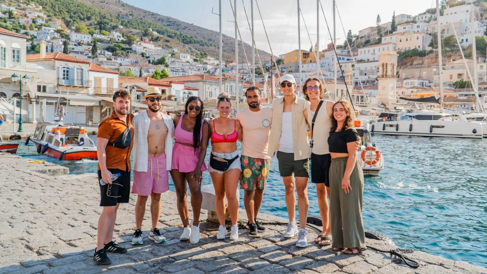 Group of friends pose for a photo in Hydra